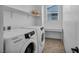 Well-lit laundry room is equipped with Samsung washer and dryer and also features a desk at 8055 Tank Loop St, Las Vegas, NV 89166