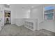 Open loft area features neutral walls, carpet, and storage shelves at 8055 Tank Loop St, Las Vegas, NV 89166