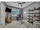 Office with a ceiling fan, shelving, and a barrel for decor at 8055 Tank Loop St, Las Vegas, NV 89166