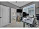 Home office with large window and gray walls features a view into the adjacent bathroom at 8055 Tank Loop St, Las Vegas, NV 89166