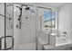 Clean bathroom with a glass-enclosed shower and separate soaking tub, offering a spa-like experience at 8055 Tank Loop St, Las Vegas, NV 89166