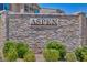 The community's name, Aspen, is displayed on a stone wall with manicured landscaping at 8055 Tank Loop St, Las Vegas, NV 89166