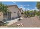 A view of a backyard featuring desert landscaping, a barbecue, and a view of the house at 8242 Tribute Ln, Las Vegas, NV 89147