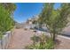 A view of a backyard featuring desert landscaping, and a grill on the side at 8242 Tribute Ln, Las Vegas, NV 89147