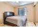Cozy bedroom with ample natural light, neutral walls, and tile floors at 8242 Tribute Ln, Las Vegas, NV 89147