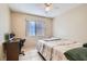 Bedroom featuring a desk with a chair, and a window overlooking the outside at 8242 Tribute Ln, Las Vegas, NV 89147
