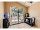 Room with sliding glass doors overlooking the backyard, neutral paint, and tile flooring at 8242 Tribute Ln, Las Vegas, NV 89147