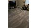 Cozy bedroom with gray carpet, a TV, and an exercise bike at 9036 Cotton Rose Way, Las Vegas, NV 89134