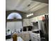 Well-lit kitchen with white cabinets, modern appliances, and ample counter space at 9036 Cotton Rose Way, Las Vegas, NV 89134