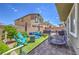 Backyard with turf, seating area, hot tub, trampoline, and privacy wall at 9208 S Park St, Las Vegas, NV 89178