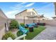 Inviting backyard featuring a patio, artificial grass, seating, and a luxurious hot tub at 9208 S Park St, Las Vegas, NV 89178