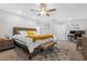 Bright bedroom boasts a ceiling fan and neutral tones, creating a relaxing atmosphere at 9208 S Park St, Las Vegas, NV 89178
