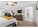 Bedroom with workstation, closet, and neutral decor, providing comfort and functionality at 9208 S Park St, Las Vegas, NV 89178