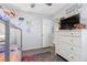 Cozy bedroom featuring a bunk bed, gray walls, carpeted floor and a white dresser with TV at 9208 S Park St, Las Vegas, NV 89178