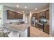 Modern kitchen with stainless steel appliances, granite countertops, and tile flooring at 9208 S Park St, Las Vegas, NV 89178