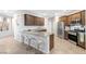 Stylish kitchen featuring granite countertops, stainless steel appliances, ample cabinetry, and a convenient breakfast bar area at 9208 S Park St, Las Vegas, NV 89178