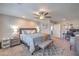 Spacious main bedroom offering room for a seating area or desk, great natural light, and neutral tones at 9208 S Park St, Las Vegas, NV 89178