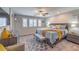 Comfortable main bedroom featuring a ceiling fan, and three windows for ample natural light at 9208 S Park St, Las Vegas, NV 89178