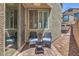 Inviting outdoor patio featuring comfortable seating and a view of the neighborhood at 9208 S Park St, Las Vegas, NV 89178