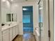 Spacious bathroom with double vanity, separate tub and shower, and views into bedroom at 965 Nevada State Dr # 39102, Henderson, NV 89002