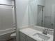 Bathroom features a shower-tub combo with white subway tile and a single sink vanity at 965 Nevada State Dr # 39102, Henderson, NV 89002