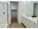 Contemporary bathroom showcasing double sink vanity, glass enclosed shower, and walk-in closet at 965 Nevada State Dr # 39102, Henderson, NV 89002