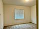 Carpeted bedroom with a window and neutral walls at 965 Nevada State Dr # 39102, Henderson, NV 89002