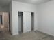 Neutral bedroom featuring carpet floors and a closet with white sliding doors at 965 Nevada State Dr # 39102, Henderson, NV 89002