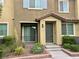 View of the front of the home showing covered front entrance with desert landscaping at 965 Nevada State Dr # 39102, Henderson, NV 89002