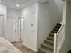 Hallway featuring staircase, neutral walls, and access to a second floor at 965 Nevada State Dr # 39102, Henderson, NV 89002