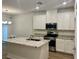 Contemporary kitchen with granite countertops, stainless steel appliances and white cabinets at 965 Nevada State Dr # 39102, Henderson, NV 89002