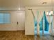 Bright living room featuring wood floors with sliding glass doors leading to an outdoor patio at 965 Nevada State Dr # 39102, Henderson, NV 89002