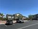 Property featuring a parking lot with two cars parked in view at 965 Nevada State Dr # 39102, Henderson, NV 89002