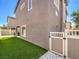 Backyard with artificial turf, privacy fence, and a side gate at 982 Sable Chase Pl, Henderson, NV 89011