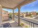 Balcony view overlooking neighborhood with houses and lush green trees at 982 Sable Chase Pl, Henderson, NV 89011