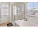 Bright bathroom showcasing a separate bathtub and shower area with natural light at 982 Sable Chase Pl, Henderson, NV 89011