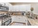 Kitchen with white cabinets, stainless steel appliances, and granite countertops at 982 Sable Chase Pl, Henderson, NV 89011