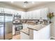 Kitchen with white cabinets, stainless steel appliances, and granite countertops at 982 Sable Chase Pl, Henderson, NV 89011