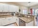 Well-lit kitchen featuring granite counters, stainless steel appliances, and decorative backsplash at 982 Sable Chase Pl, Henderson, NV 89011