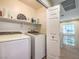 Well-lit laundry room with modern washer and dryer appliances at 982 Sable Chase Pl, Henderson, NV 89011