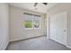 Inviting bedroom with plush carpet, large windows, and a spacious closet provides ample storage at 10270 Turkish Pine Ct, Las Vegas, NV 89166