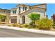 A two-story stucco home showcasing desert landscaping and a brown tile roof at 10270 Turkish Pine Ct, Las Vegas, NV 89166