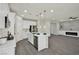 Open kitchen with modern appliances, a large island, and a view to the living room at 10270 Turkish Pine Ct, Las Vegas, NV 89166