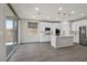 Kitchen with modern appliances, a large island, and a sliding glass door to the backyard at 10270 Turkish Pine Ct, Las Vegas, NV 89166