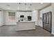 Bright kitchen with white cabinets, stainless steel appliances, and a kitchen island at 10270 Turkish Pine Ct, Las Vegas, NV 89166