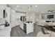 Open kitchen with white cabinets, stainless steel appliances, and a large island at 10270 Turkish Pine Ct, Las Vegas, NV 89166