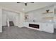 Open-concept living room features a modern fireplace, built-in storage, and a staircase leading to the upper level at 10270 Turkish Pine Ct, Las Vegas, NV 89166