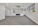 Stylish living area with a built-in fireplace, floating shelves, recessed lighting, and wood-look tile flooring at 10270 Turkish Pine Ct, Las Vegas, NV 89166