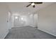 Open loft area with neutral carpet, multiple windows, and access to several rooms at 10270 Turkish Pine Ct, Las Vegas, NV 89166