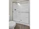 Modern white shower with clear glass doors and sleek fixtures, creating a bright and inviting bathroom space at 10270 Turkish Pine Ct, Las Vegas, NV 89166